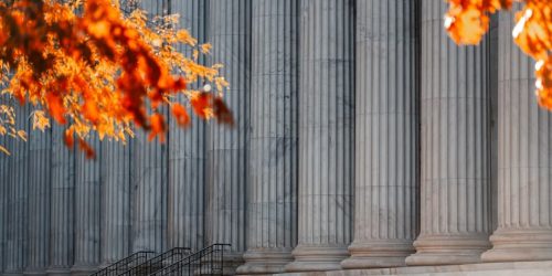 a building with columns and steps in front of it